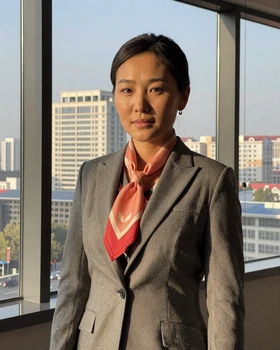 Professional Mongolian woman overlooking Ulaanbaatar city skyline