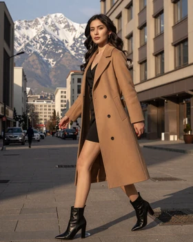 Elegant Kazakh woman in modern fashion walking in Almaty with Tien Shan mountains in the background