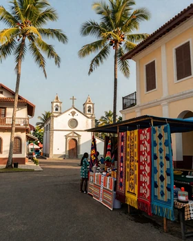 Street scene in Dili, Timor-Leste with colonial architecture and colorful market stalls