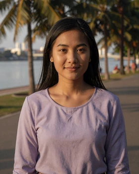 Cambodian woman smiling warmly by the Phnom Penh riverside