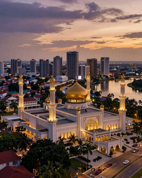 Bandar Seri Begawan Brunei skyline at dusk with illuminated golden mosque and river reflections